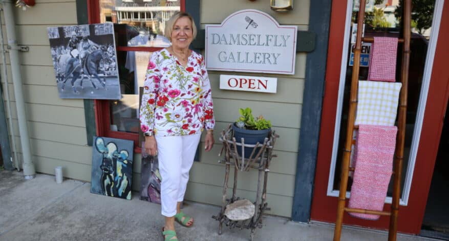 karol in front of damselfly gallery