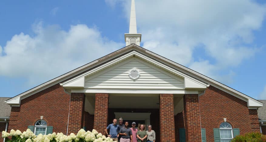 members in front of grace church