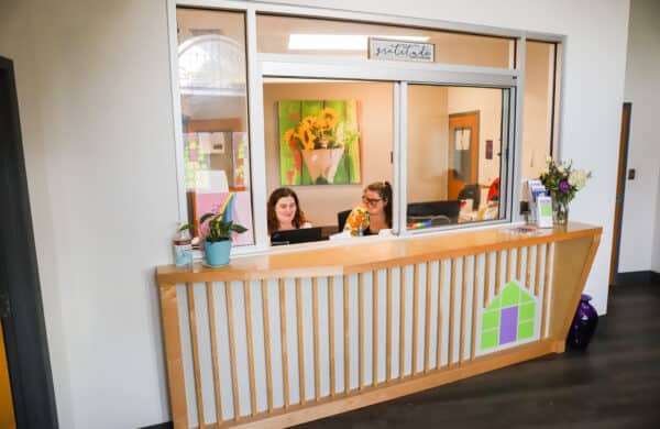 two people at front desk