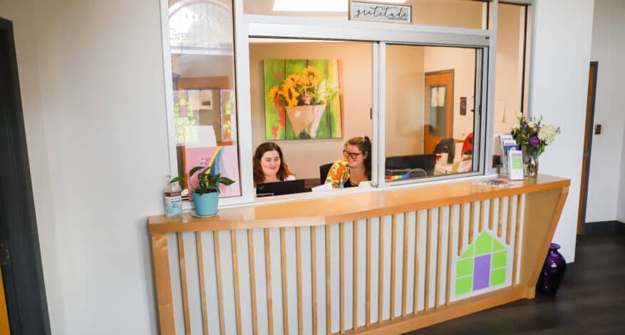 two people at front desk