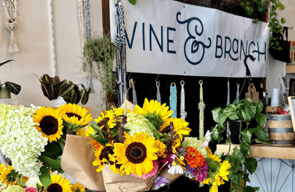 vine and branch sign with flowers