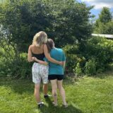 two people embracing outside