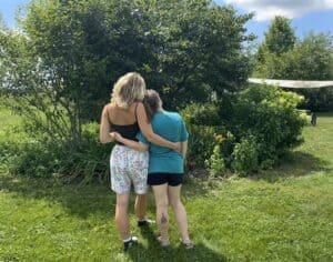 two people embracing outside