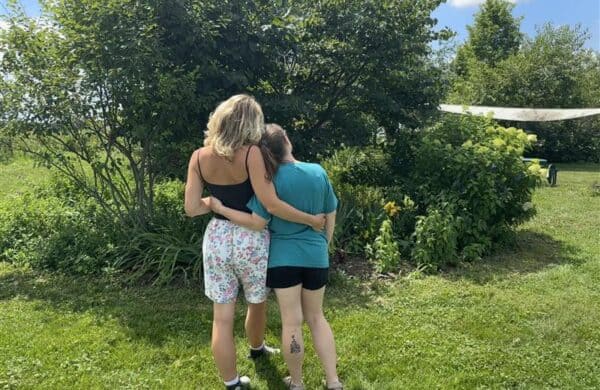 two people embracing outside