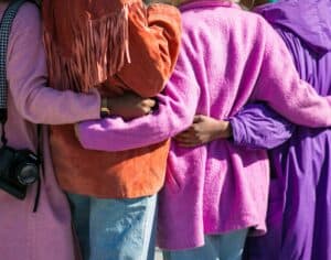 four people embracing