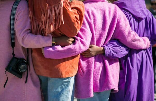 four people embracing