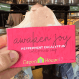 person holding awaken joy soap at north lime