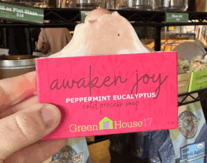 person holding awaken joy soap at north lime
