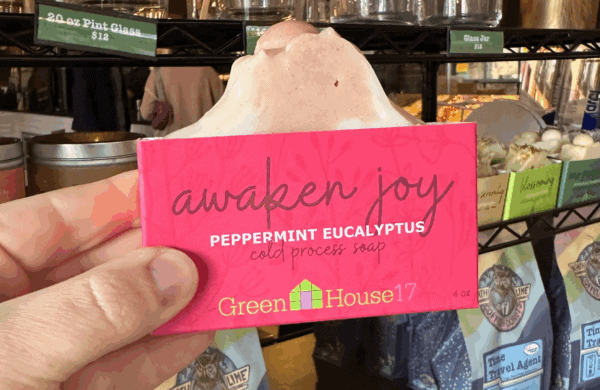 person holding awaken joy soap at north lime
