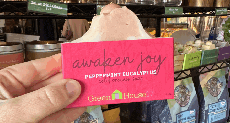 person holding awaken joy soap at north lime