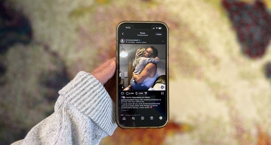 holding up phone showing instagram post